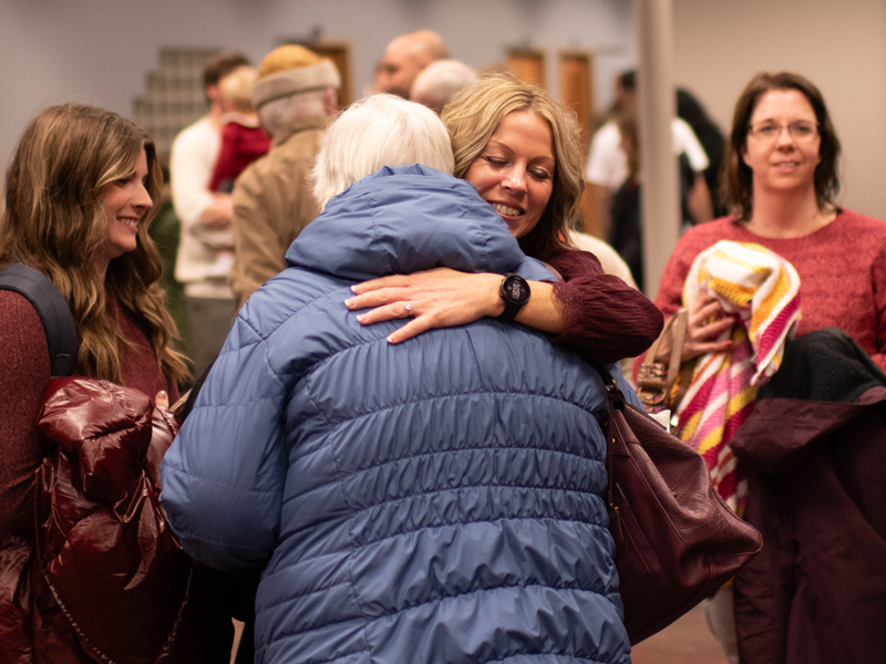 north campus people hugging and connecting